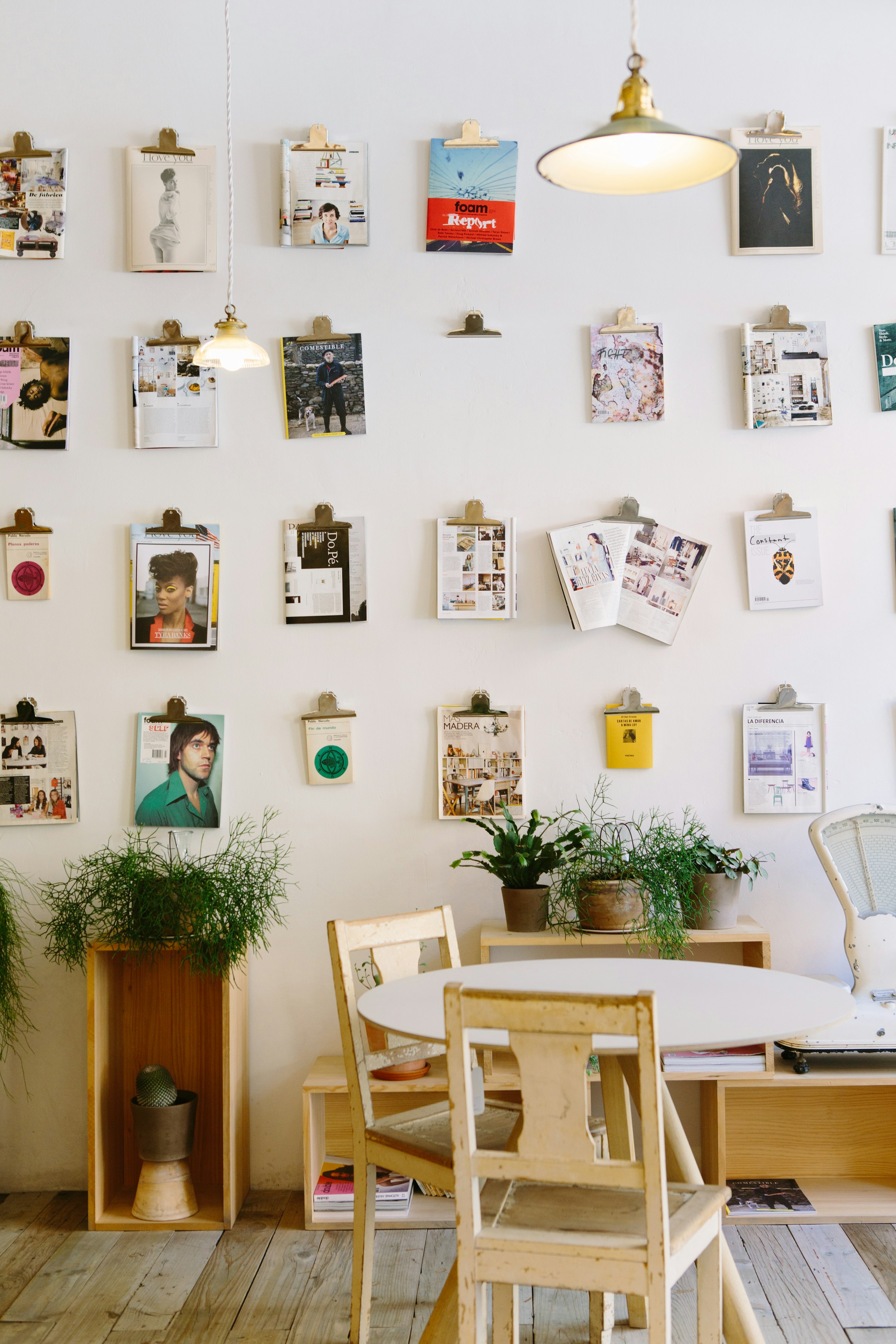 Printed work pinned to a studio wall